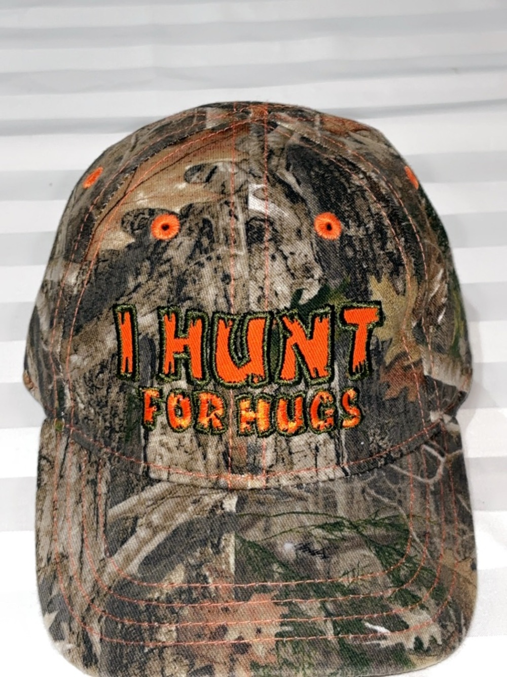 Infant “I Hunt For Hugs” camo hat